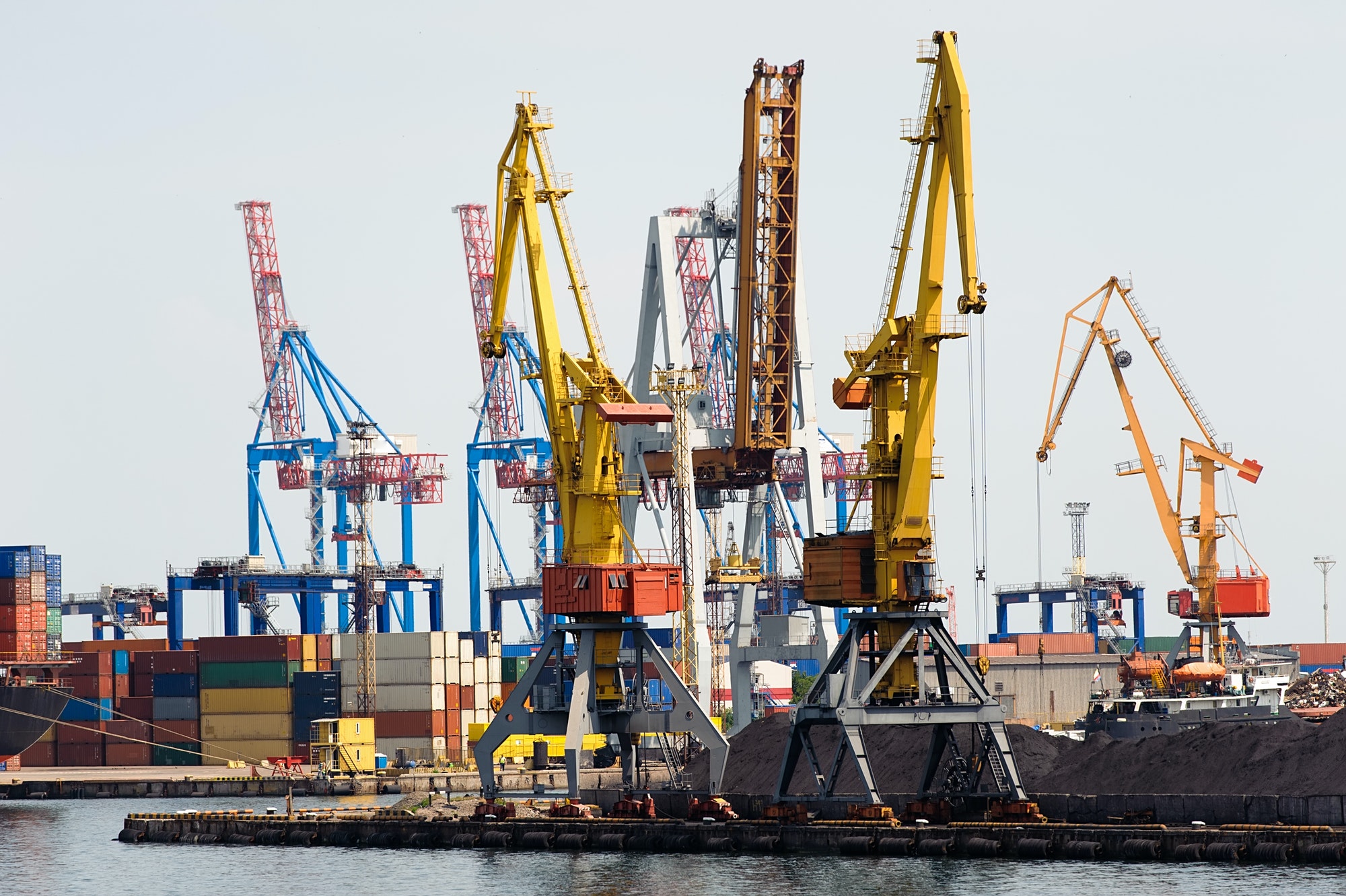 Industrial cranes and cargo on a quay